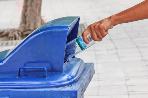 Workers managing builders waste clearance